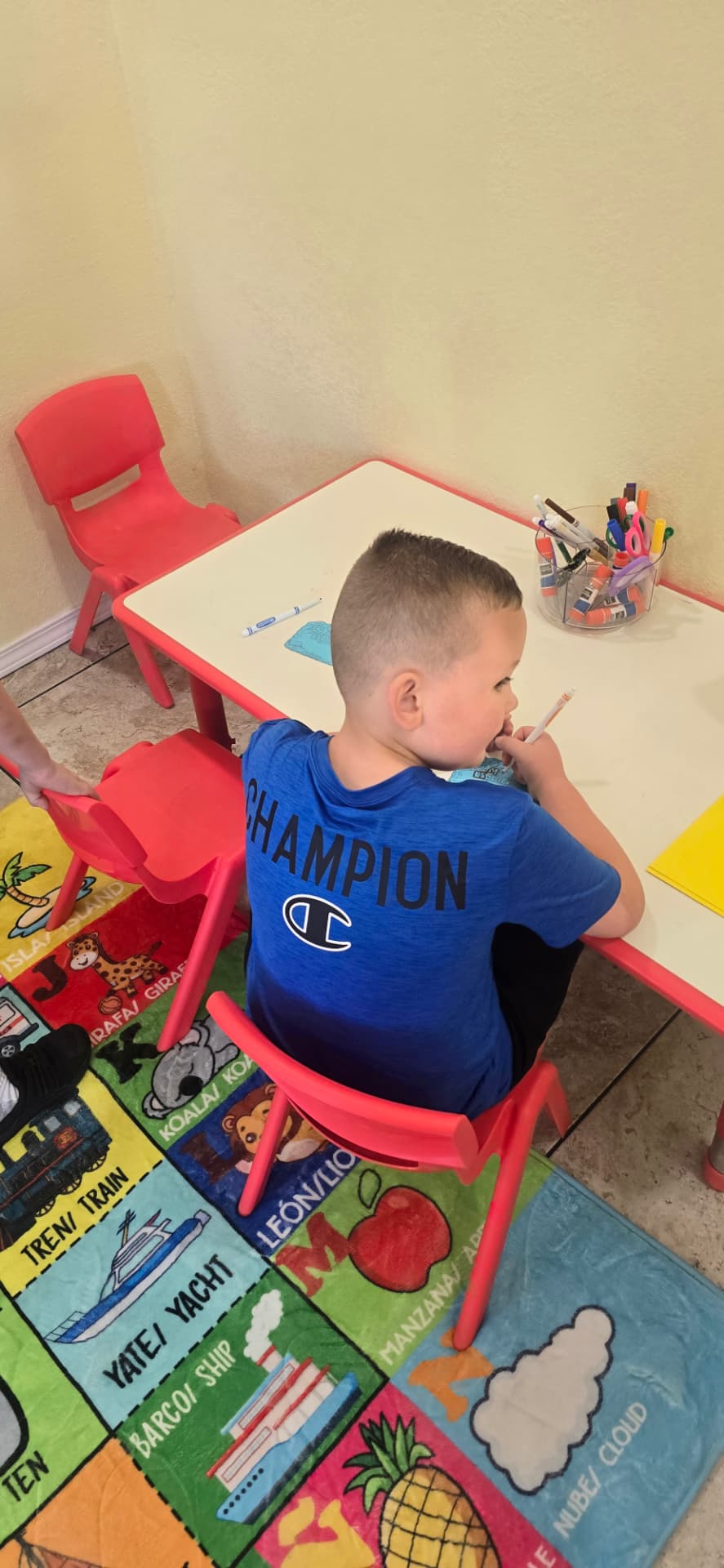 A student completing a Spanish classroom activity